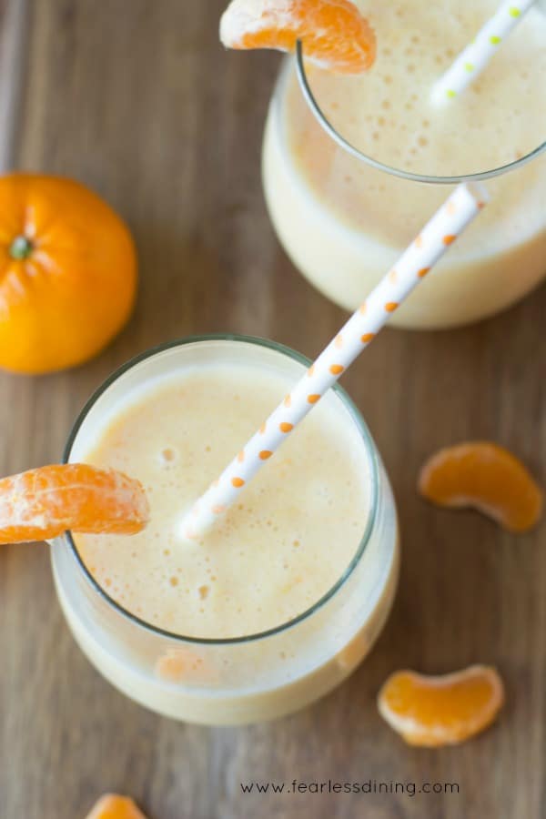 Top view of two glasses of creamsicle smoothies. 