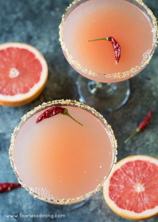 Easy pink grapefruit margaritas with a sriracha salt rim are perfect for a party.