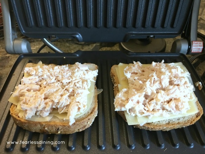 Tuna added to grilled cheese on panini machine.