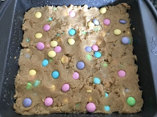 A pan full of raw cookie dough ready to bake.