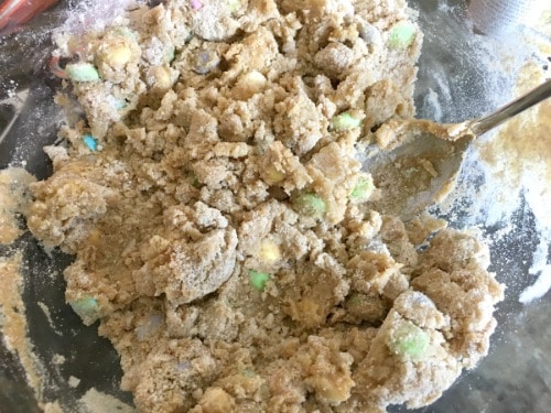 Mixing up the gluten free peanut butter cookie dough with M&Ms.