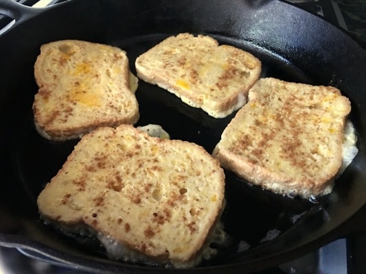 Cooking the French toast in a cast iron skillet