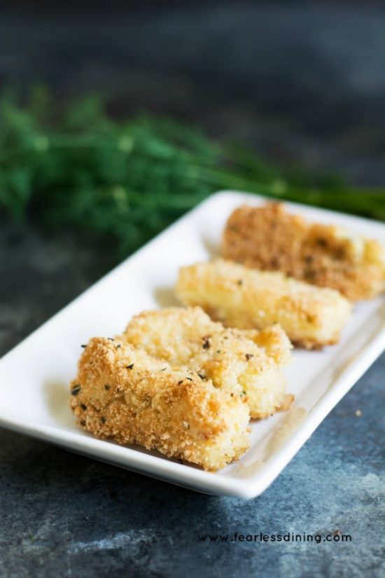 Fried mozzarella sticks on a platter