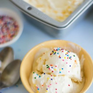 Homemade lemon curd ice cream in a bowl with sprinkles on top