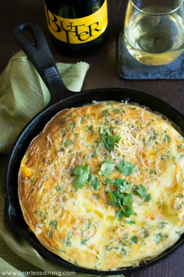 The top view of a frittata in a cast iron pan.