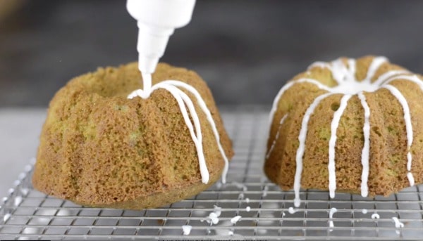 Icing the mini bundt cakes.