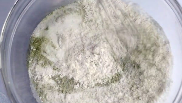 Whisking the dry ingredients in a bowl.