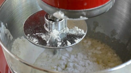 A stand mixer mixing the pizza crust ingredients.