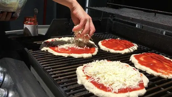 making gluten free grilled pizza on a grill