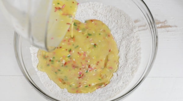 pouring the wet ingredients into the dry ingredients