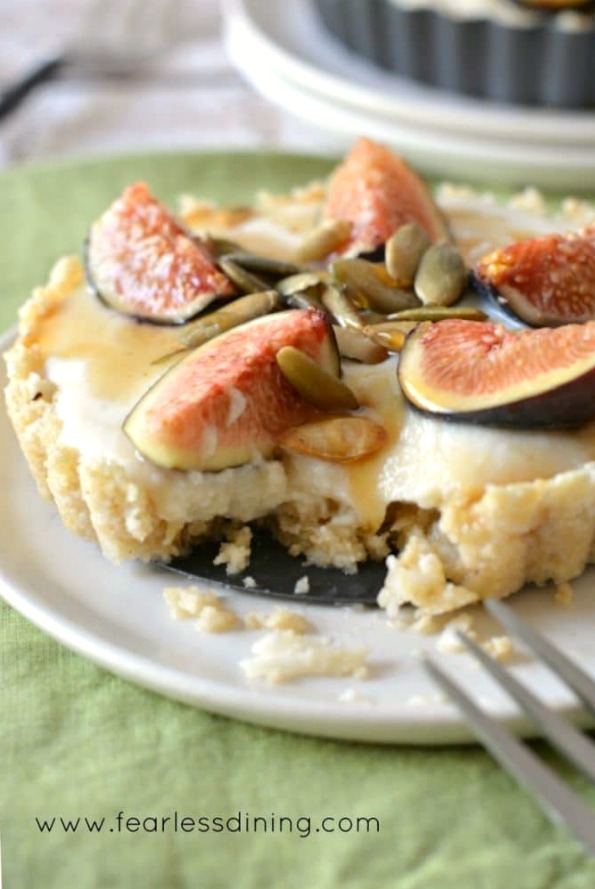 a fork cutting into a fig tart