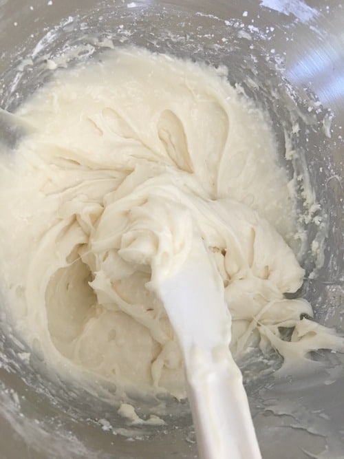 White buttercream frosting in a bowl
