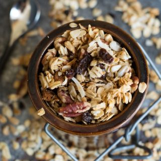 overhead image of a crock filled with a gluten free granola recipe for cinnamon granola
