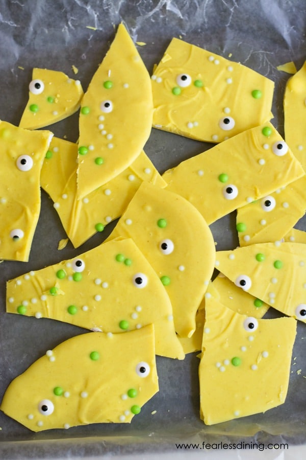 A tray of yellow white chocolate monster candy bark