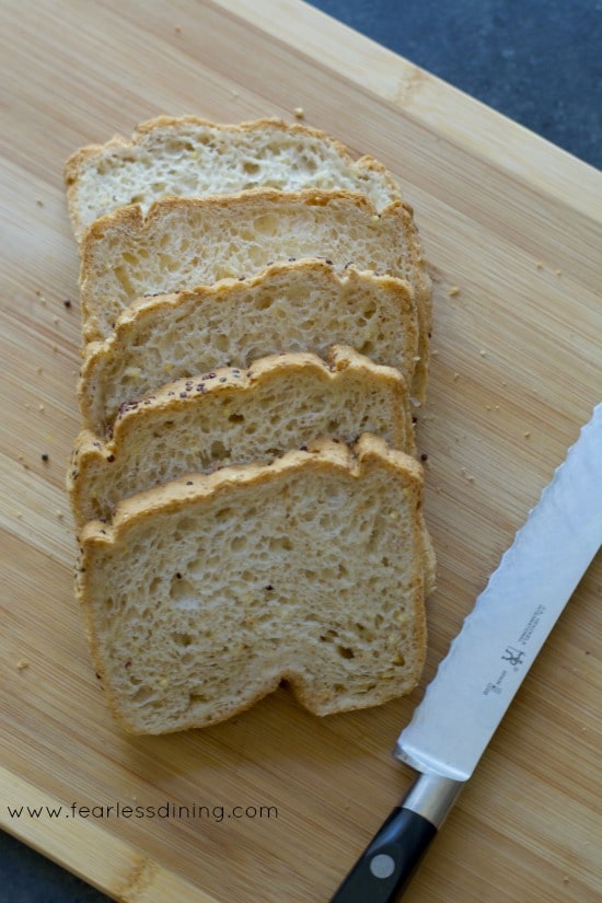 Slices of gluten free bread on a cutting board.