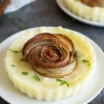 Mashed Potato bacon rose tarts on small white plates.