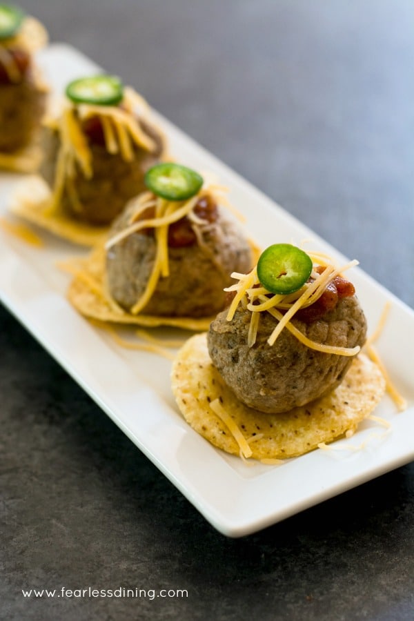 Taco meatball appetizer on a tray.