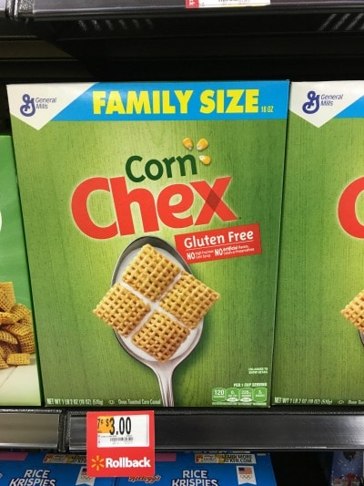 Boxes of gluten free Chex cereals on a store shelf.