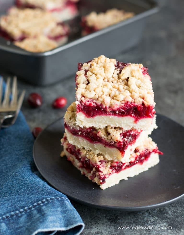 A stack of three gluten free cranberry shortbread bars.
