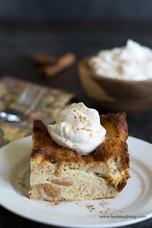 A close up of a slice of eggnog bread pudding.