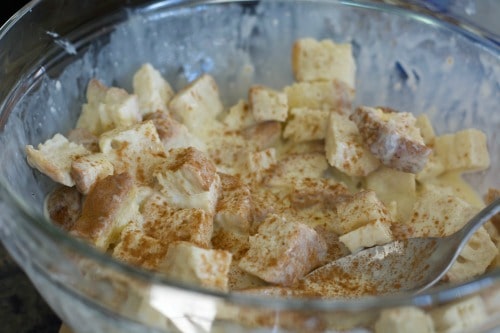 Bread cubes with eggnog in a bowl.