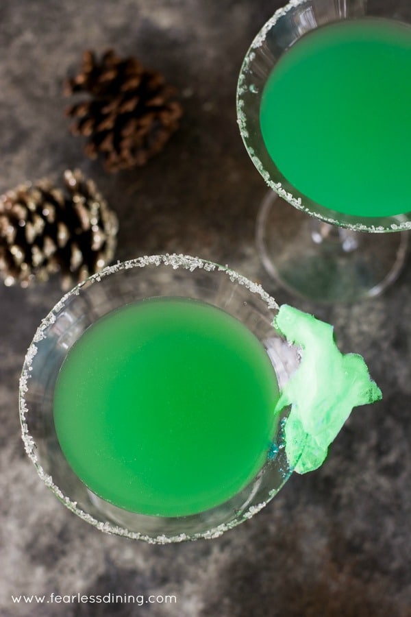 The top view of two grinch cocktails in martini glasses.