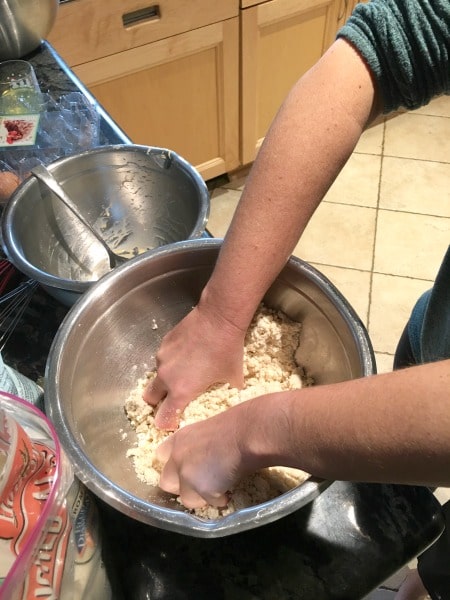 Hand mixing the cookie dough.