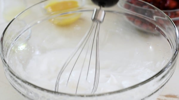 Whipping egg whites in a bowl.