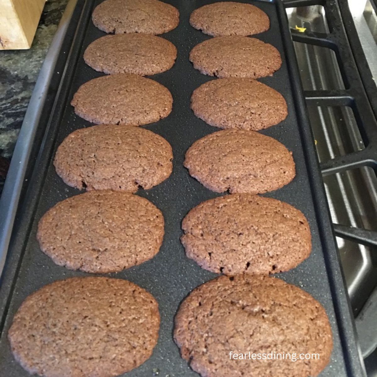 The baked chocolate Madeleines in the pan.