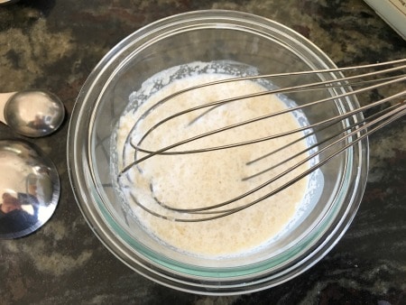 Dissolving gelatin in eggog in a small bowl.