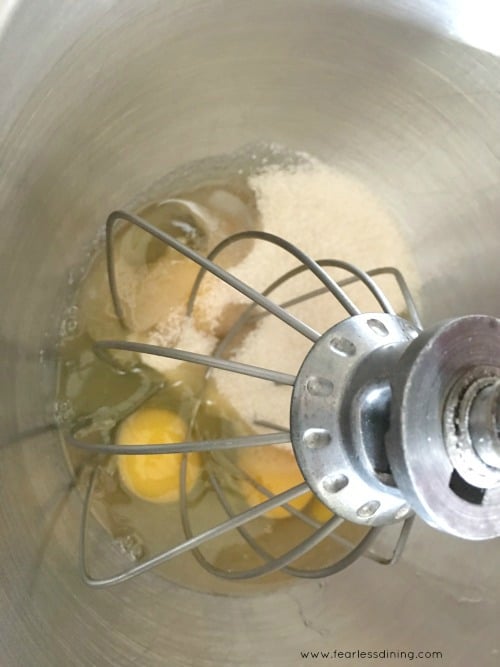 Mixing eggs with sugar in a stand mixer.