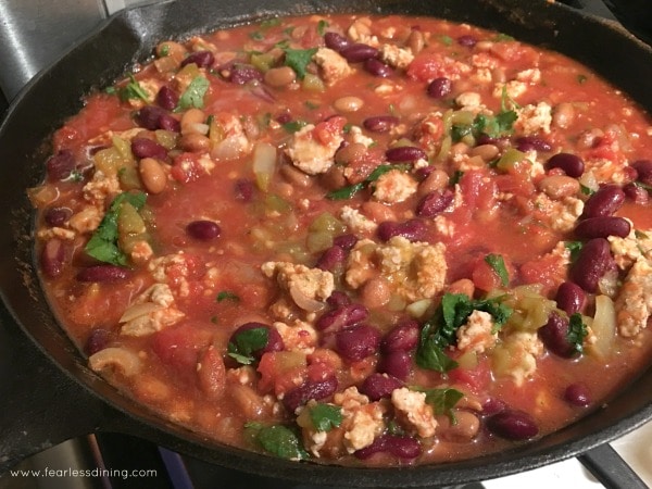 Turkey chili simmering in a pan.