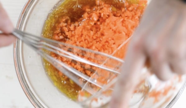 adding shredded carrot to the wet ingredients