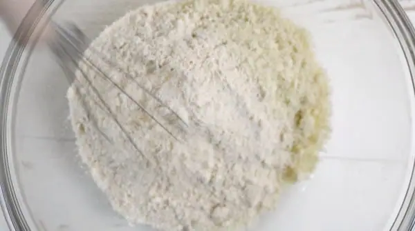 a bowl of the dry ingredients being whisked together