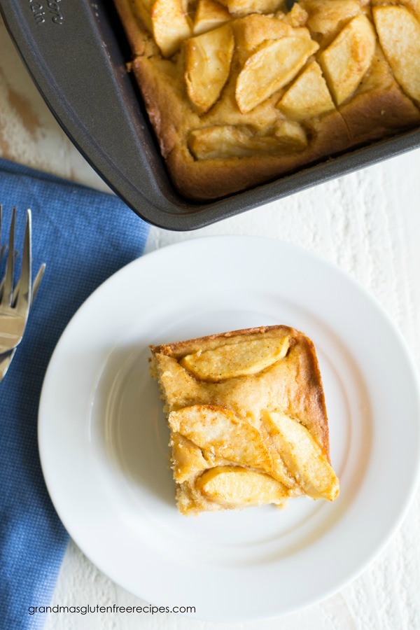 The top view of a slice of apple cake, lots of baked apple slices are on top.