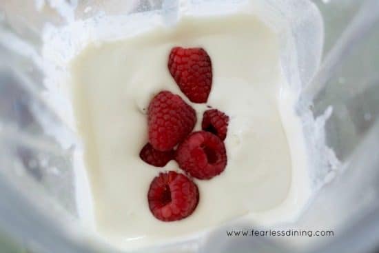 The heavy cream, dessert mix and fresh rapsberries in a blender.