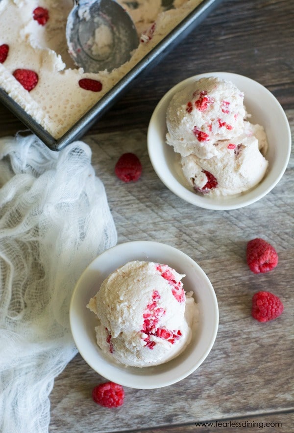 The top view of two bowls of white chocolate raspberry ice cream.