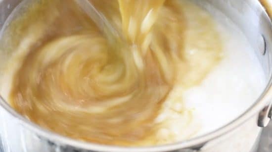 Adding egg mixture to rice.