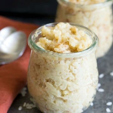 Two glass bowls filled with gluten free rice pudding.