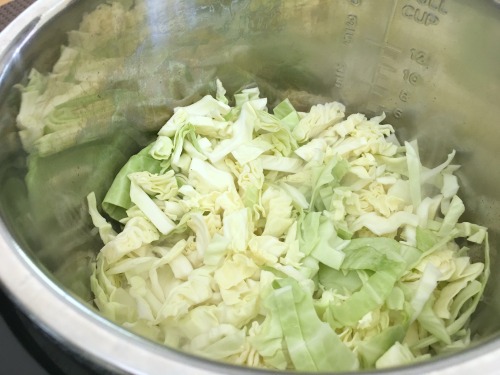 Onion and cabbage browning in an Instant Pot.