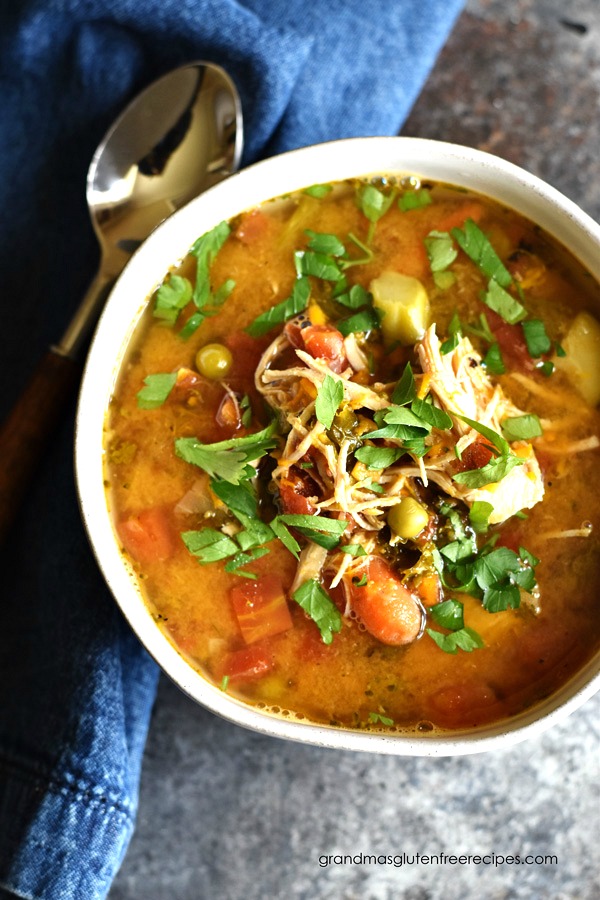 The top view of a big bowl of the chicken vegetable soup.