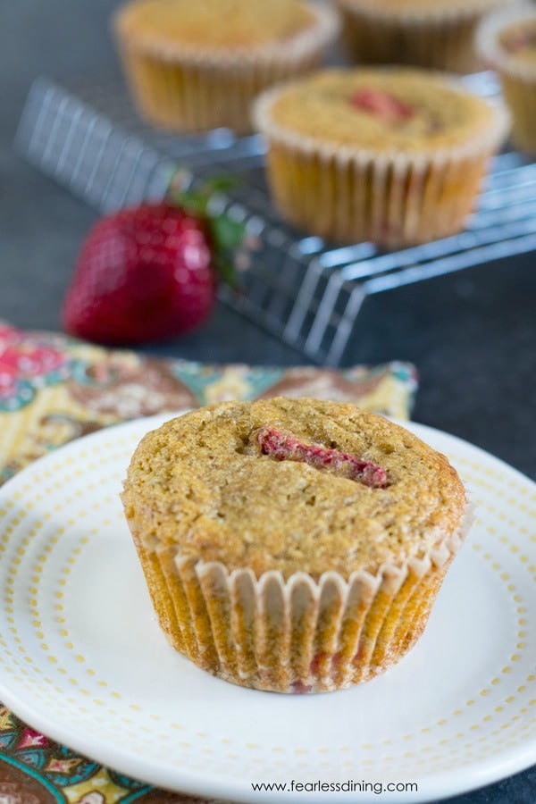 A grain-free strawberry muffin on a plate.