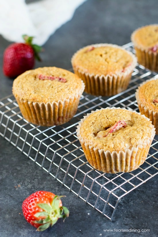 Strawberry muffins on a cooling rack.