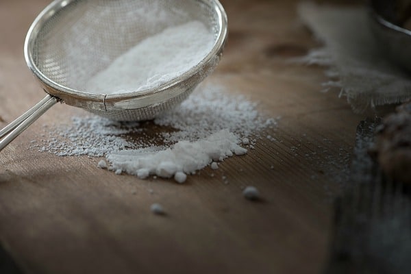 gluten free flour in a strainer