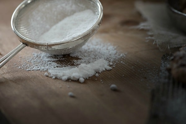 Gluten free flour in a strainer.