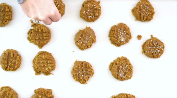 Sprinkling coarse sugar over the cookie dough.