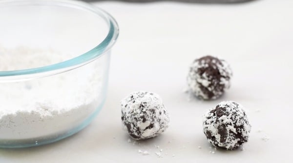 The cookie dough balls rolled in powdered sugar.