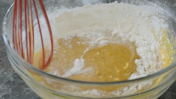 Mixing the lemon topping in a bowl.