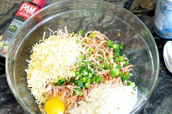 Potato hash brown waffle ingredients in a bowl.