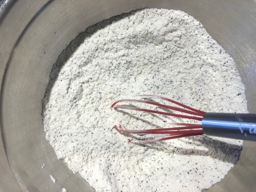 Lemon poppy seed cake dry ingredients in a bowl.